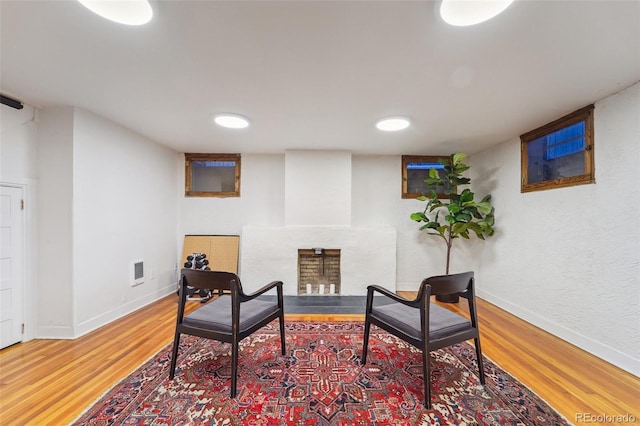 sitting room featuring wood-type flooring