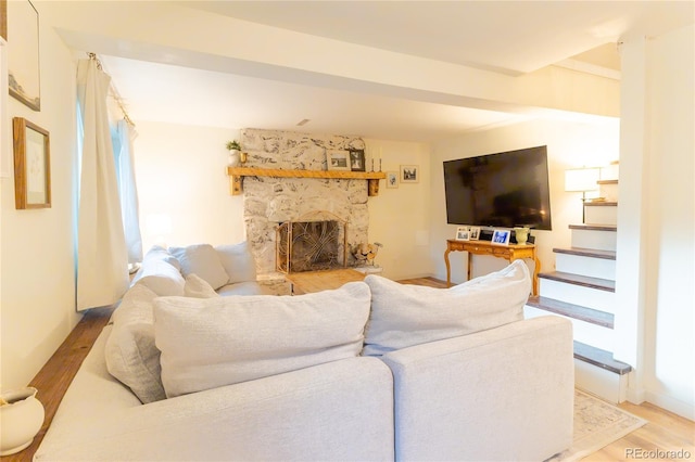 2795 SE Grapevine Rd, Idledale, CO 80453 - living room with light wood-type flooring and a fireplace