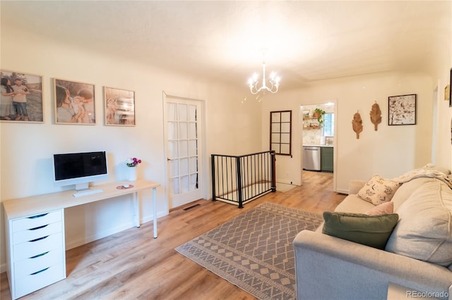 2795 SE Grapevine Rd, Idledale, CO 80453 - living area featuring light wood-style flooring, a chandelier, an office area, and baseboards
