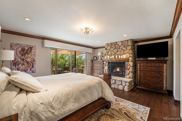 bedroom featuring crown molding, a stone fireplace, access to outside, and dark hardwood / wood-style floors