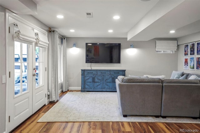 8140 S Storm King Peak, Littleton, CO 80127 - living area with wood finished floors, recessed lighting, and baseboards