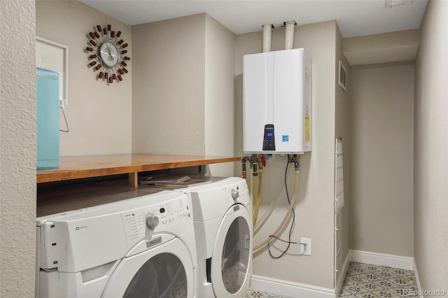 8140 S Storm King Peak, Littleton, CO 80127 - clothes washing area with tankless water heater, separate washer and dryer, and baseboards