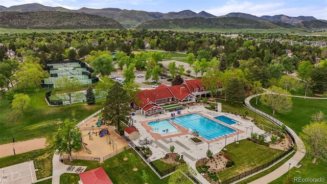 8140 S Storm King Peak, Littleton, CO 80127 - aerial view of a pool and a mountain backdrop