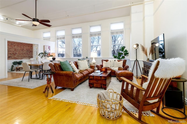 1140 Columbine St Unit 302, Denver, CO 80206 - living room with hardwood / wood-style floors, ceiling fan, and rail lighting