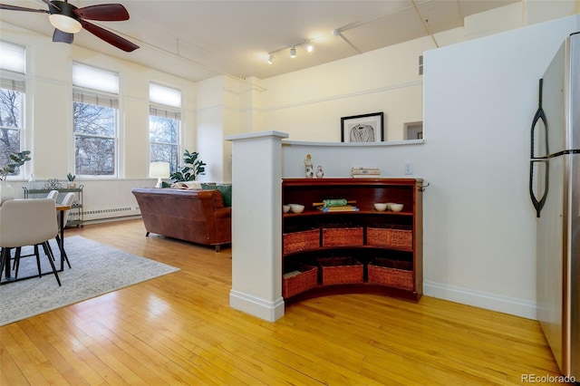 1140 Columbine St Unit 302, Denver, CO 80206 - office area with a ceiling fan, light wood-style flooring, a baseboard heating unit, and rail lighting