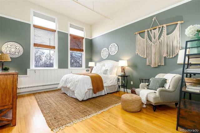1140 Columbine St Unit 302, Denver, CO 80206 - bedroom featuring a baseboard heating unit and wood-type flooring