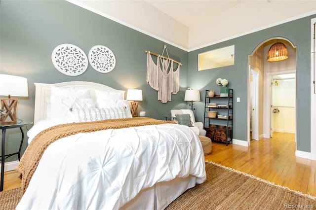 1140 Columbine St Unit 302, Denver, CO 80206 - bedroom featuring wood finished floors and arched walkways