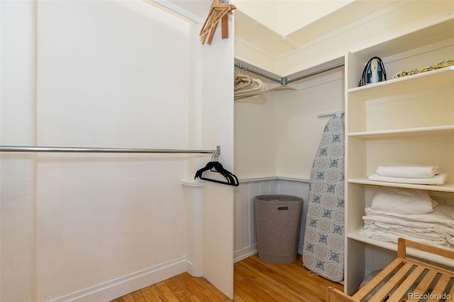 1140 Columbine St Unit 302, Denver, CO 80206 - walk in closet featuring wood finished floors