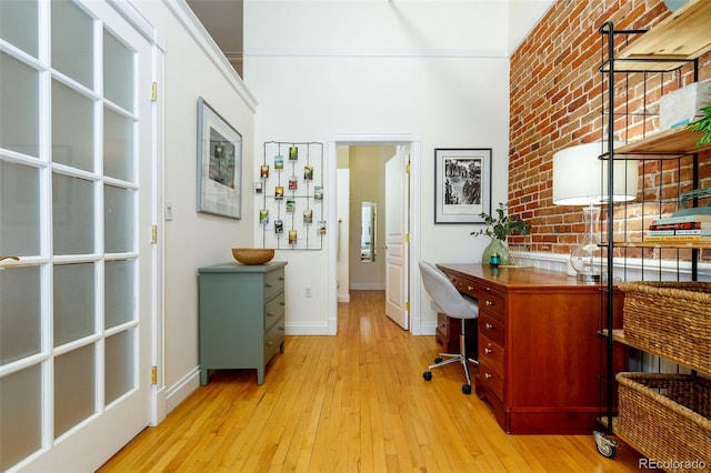 1140 Columbine St Unit 302, Denver, CO 80206 - office featuring light wood finished floors and brick wall