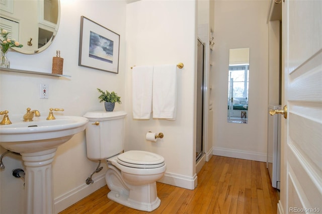 1140 Columbine St Unit 302, Denver, CO 80206 - bathroom with wood-type flooring and a stall shower