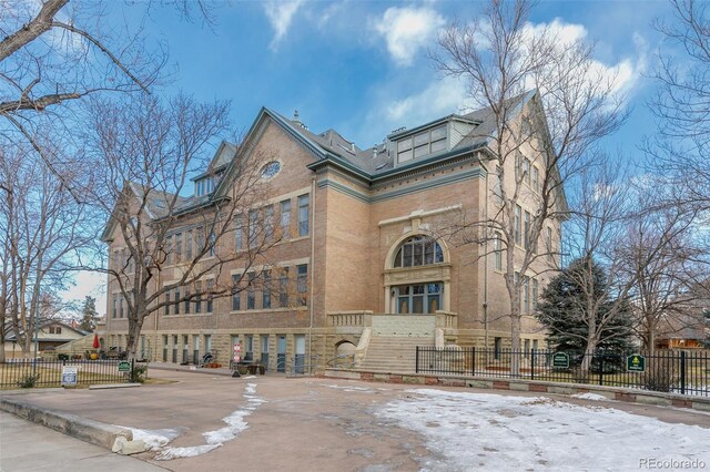 1140 Columbine St Unit 302, Denver, CO 80206 - snow covered building featuring uncovered parking
