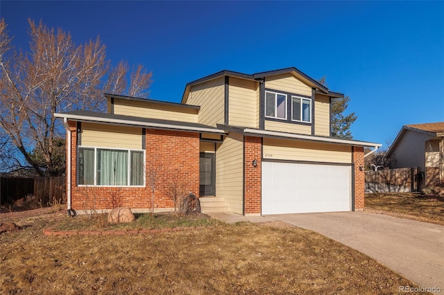 traditional-style home with brick siding, concrete driveway, fence, and a garage