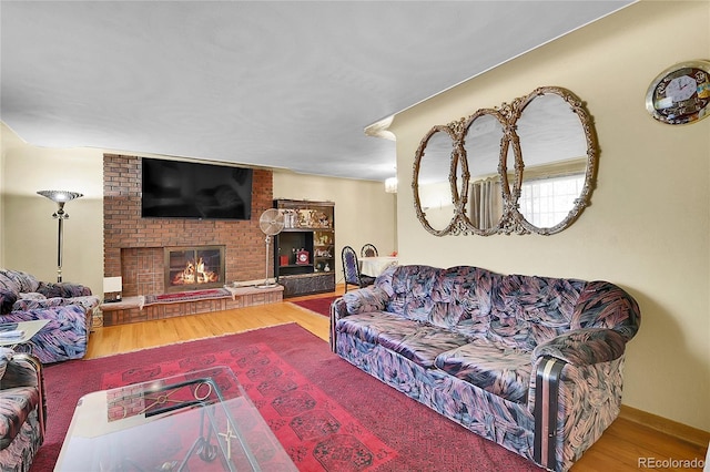 4705 Upham St, Wheat Ridge, CO 80033 - living area with wood finished floors and a fireplace