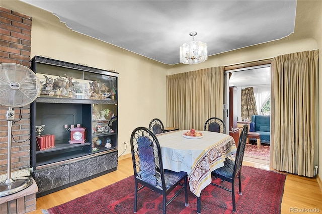 4705 Upham St, Wheat Ridge, CO 80033 - dining area featuring a chandelier and wood finished floors