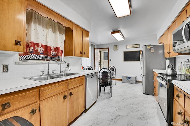 4705 Upham St, Wheat Ridge, CO 80033 - kitchen with stainless steel appliances, decorative backsplash, light countertops, light marble finish flooring, and brown cabinetry