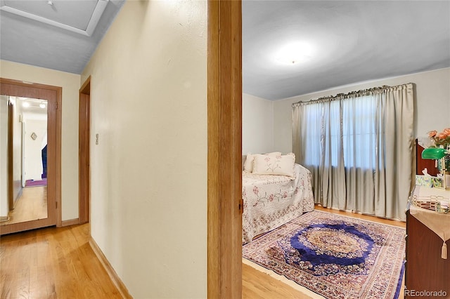4705 Upham St, Wheat Ridge, CO 80033 - bedroom with light wood finished floors and attic access