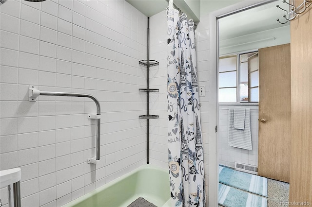 4705 Upham St, Wheat Ridge, CO 80033 - bathroom with shower / bathtub combination with curtain