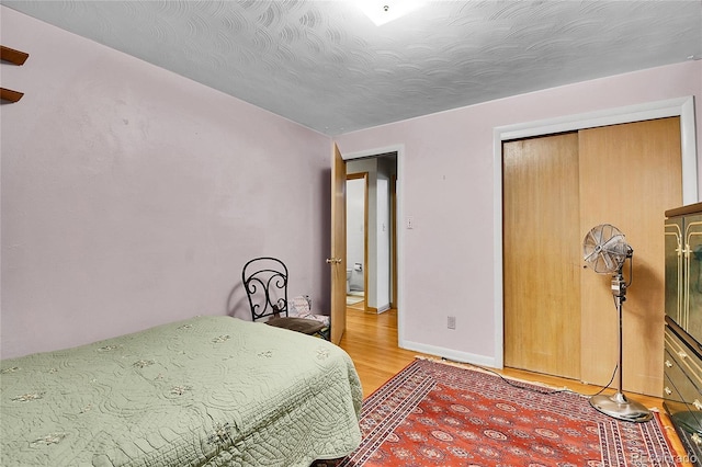 4705 Upham St, Wheat Ridge, CO 80033 - bedroom with light wood-type flooring and baseboards
