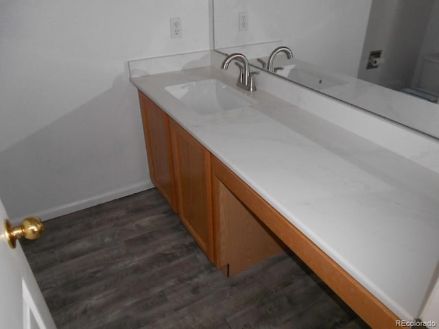 bathroom featuring vanity and hardwood / wood-style floors