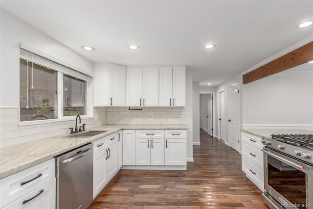5890 W Quarles Dr, Littleton, CO 80128 - kitchen with stainless steel appliances, a sink, recessed lighting, tasteful backsplash, and dark wood-style floors