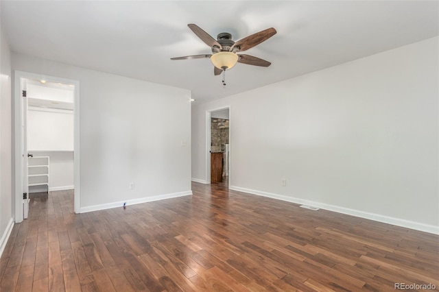 5890 W Quarles Dr, Littleton, CO 80128 - empty room with ceiling fan, dark wood-style flooring, and baseboards
