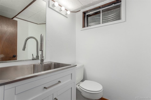 5890 W Quarles Dr, Littleton, CO 80128 - bathroom featuring vanity, toilet, and a drop ceiling