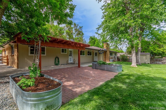 5890 W Quarles Dr, Littleton, CO 80128 - rear view of house with a patio and a chimney
