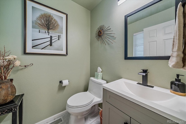 10389 W Fair Ave Unit E, Littleton, CO 80127 - bathroom featuring vanity, toilet, and baseboards