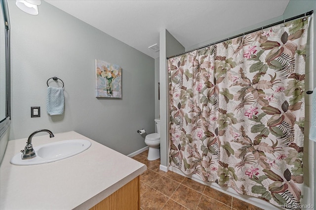 10389 W Fair Ave Unit E, Littleton, CO 80127 - full bathroom featuring vanity, toilet, and tile patterned floors
