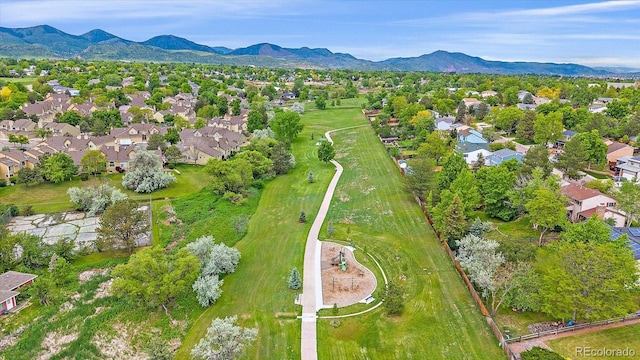 10389 W Fair Ave Unit E, Littleton, CO 80127 - aerial view of residential area featuring a mountain backdrop and a golf course