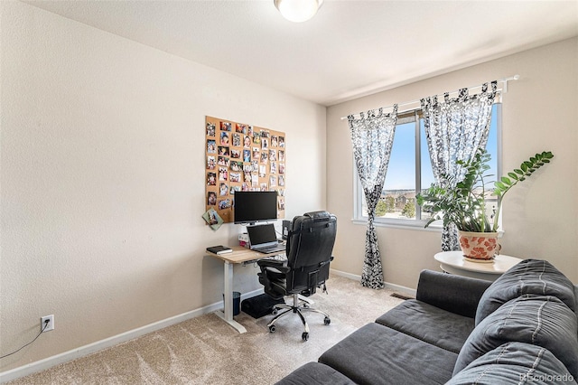 home office with light carpet and baseboards