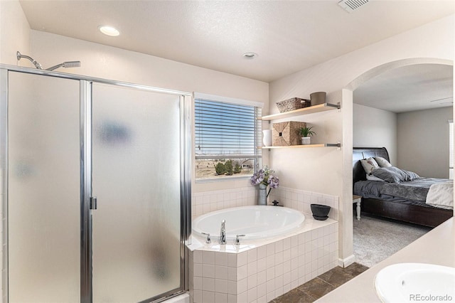 ensuite bathroom with a bath, a stall shower, visible vents, and connected bathroom