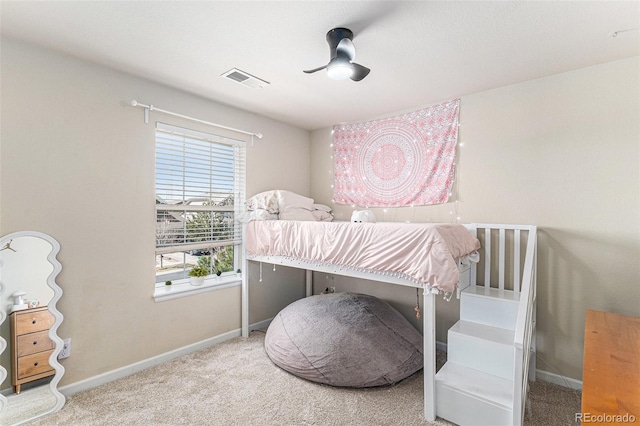 carpeted bedroom with ceiling fan, baseboards, and visible vents