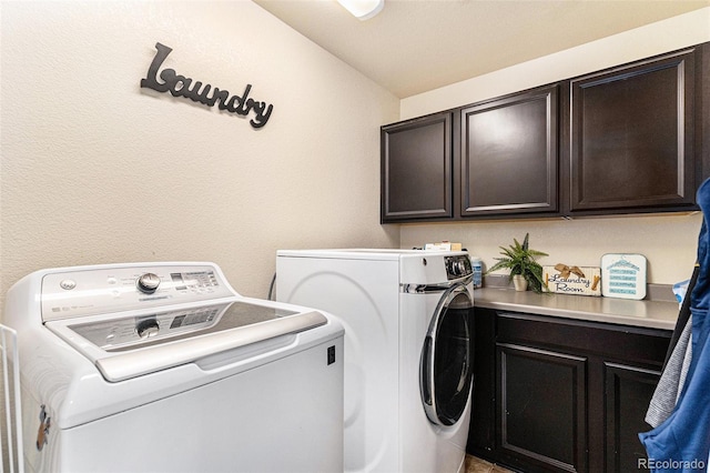 laundry area featuring washer and dryer and cabinet space