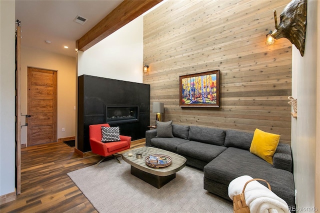 467 E Arkansas St, Buena Vista, CO 81211 - living area featuring wooden walls, wood finished floors, beam ceiling, and recessed lighting