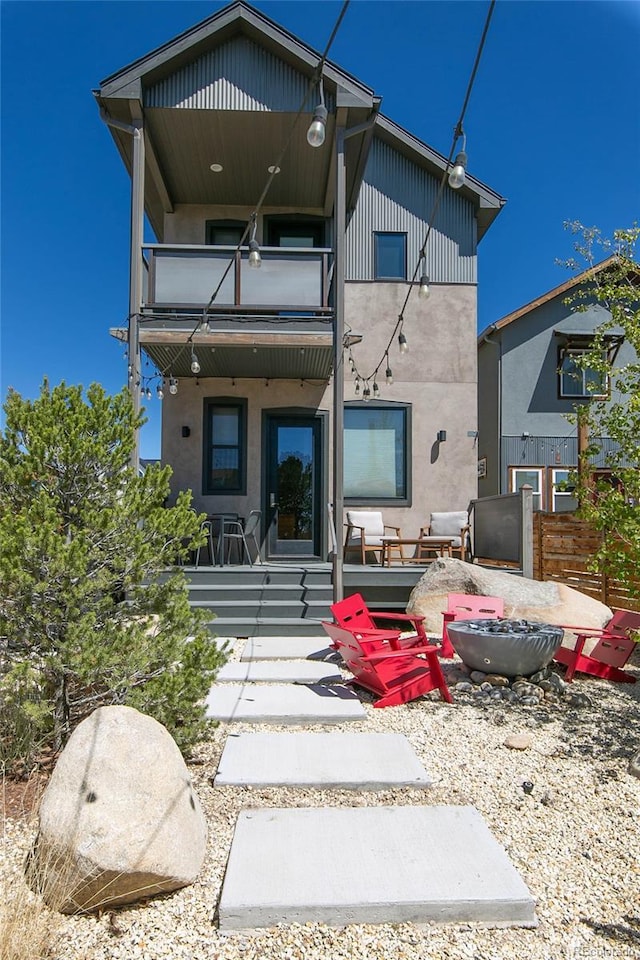 467 E Arkansas St, Buena Vista, CO 81211 - back of house featuring a balcony, a patio area, and stucco siding