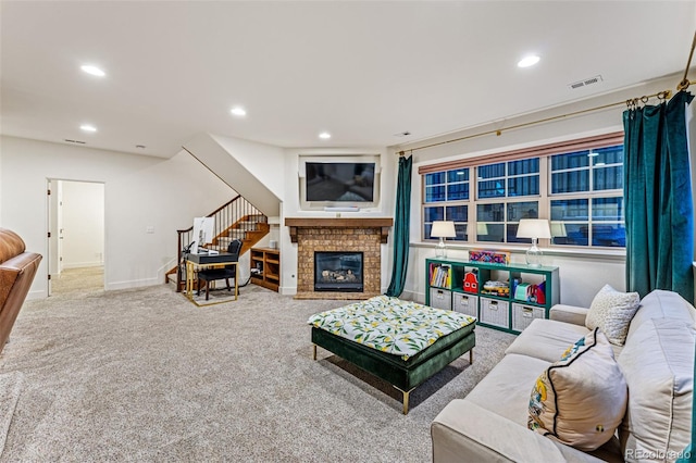 carpeted living room featuring a fireplace