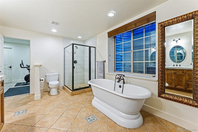 full bathroom with tile patterned floors, vanity, and shower with separate bathtub