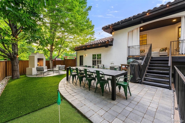 view of patio / terrace with an outdoor fireplace