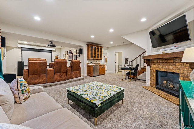 carpeted living room featuring a brick fireplace and bar