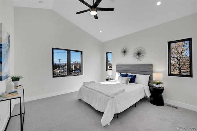 carpeted bedroom with high vaulted ceiling, baseboards, visible vents, and recessed lighting