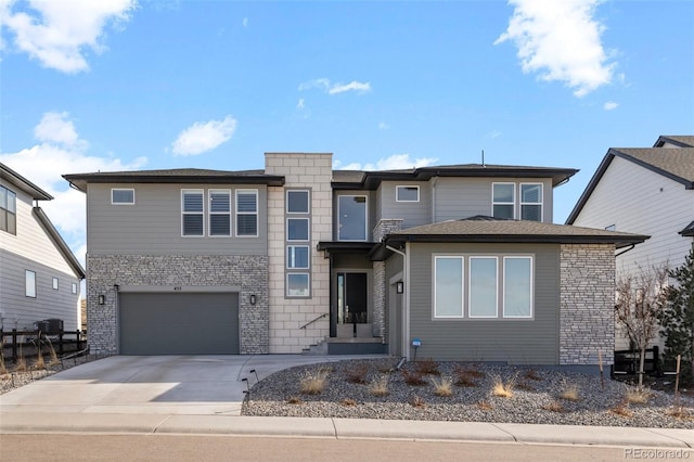 prairie-style house featuring a garage and concrete driveway