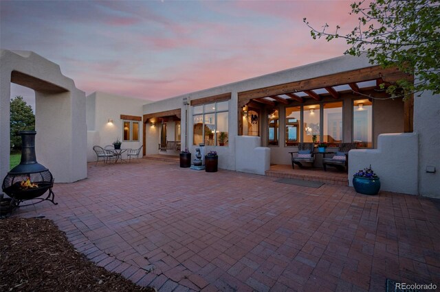 view of patio / terrace featuring a fire pit