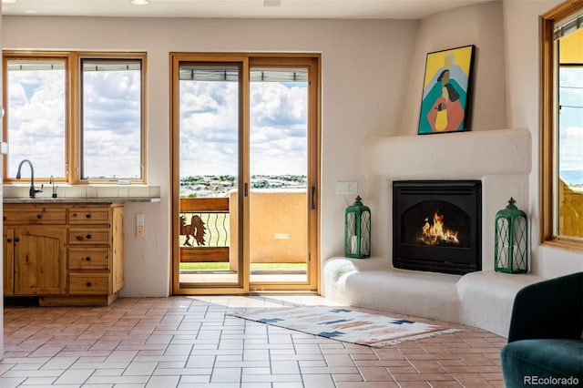 living area with healthy amount of natural light and a warm lit fireplace