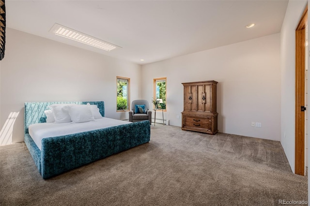 bedroom with carpet floors, recessed lighting, and baseboard heating