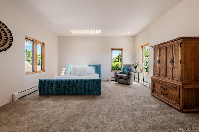 carpeted bedroom with a baseboard radiator
