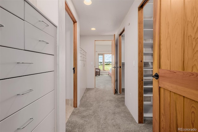 hall featuring light colored carpet and recessed lighting