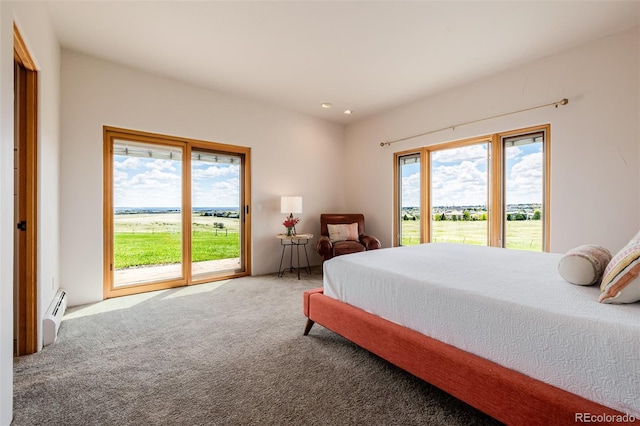 bedroom featuring a baseboard heating unit, access to outside, carpet flooring, and recessed lighting