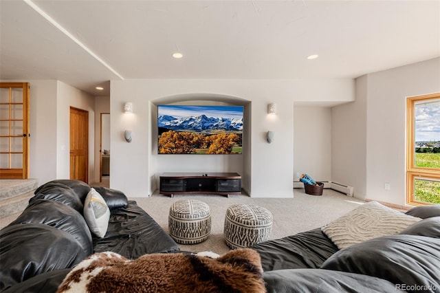 carpeted living room with a baseboard heating unit and recessed lighting