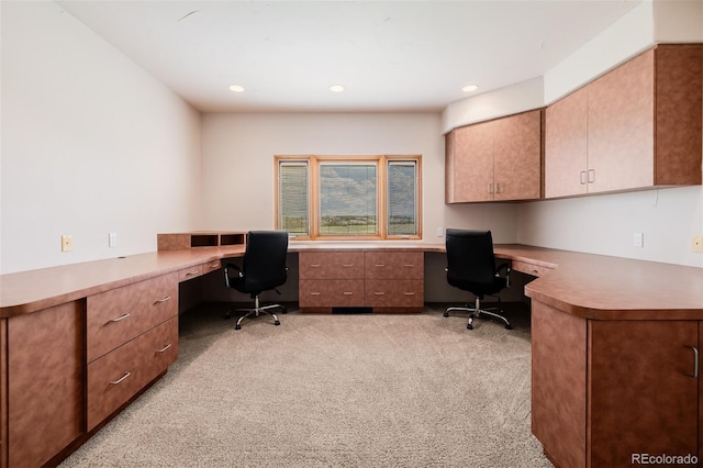office space with built in study area, light carpet, and recessed lighting